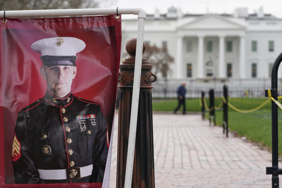 A poster photo of U.S. Marine Corps veteran and Russian prisoner Trevor Reed stands near the White House. (Photo / AP)