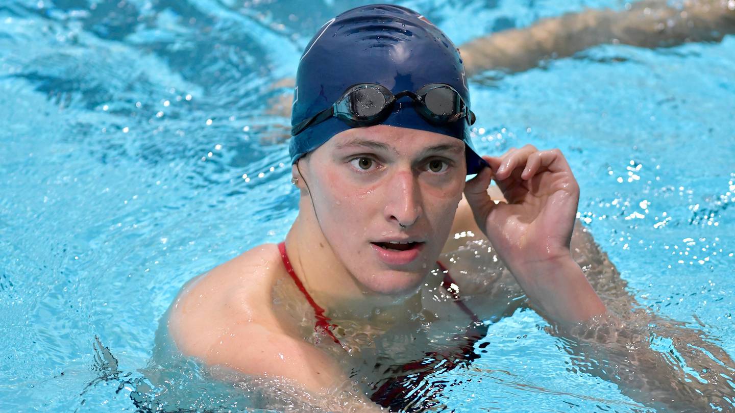 Transgender swimmer Lia Thomas speaks to her coach after winning the 500 metre freestyle for Pennsylvania during a meet with Harvard. (Photo / AP)