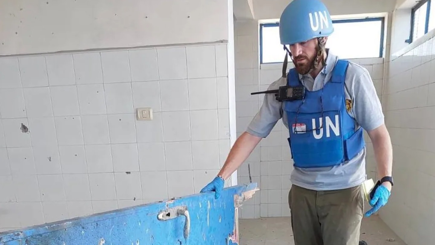 Hector Sharp assessing a school hit during the conflict. Photo: Supplied / Stefania Rigotto