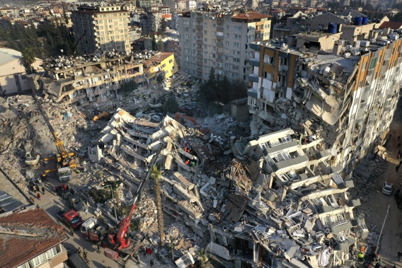 Rescue teams search for people as cranes remove debris from destroyed buildings in Antakya, southeastern Turkey, Friday, Feb. 10, 2023. Rescuers pulled several earthquake survivors from the shattered remnants of buildings Friday, including some who lasted more than 100 hours trapped under crushed concrete after the disaster slammed Turkey and Syria. Photo / AP