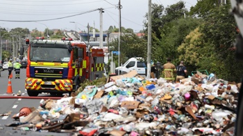 Watch: Rubbish strewn across road after recycling truck catches fire