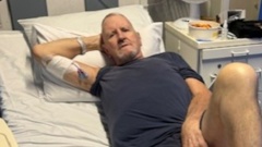 Palmerston North real estate agent Andy Stewart is still in hospital more than a month after suffering a white-tail spider bite.