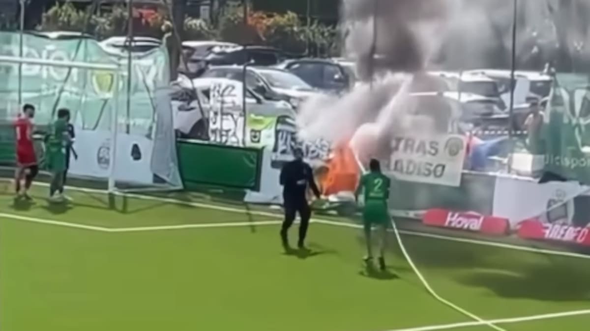 Former Premier League defender grabs hose to put out pitchside fire mid-game