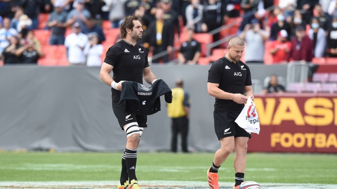 Sam Whitelock and Dane Coles carry jerseys as a tribute to Sean Wainui. (Photo / Photosport)