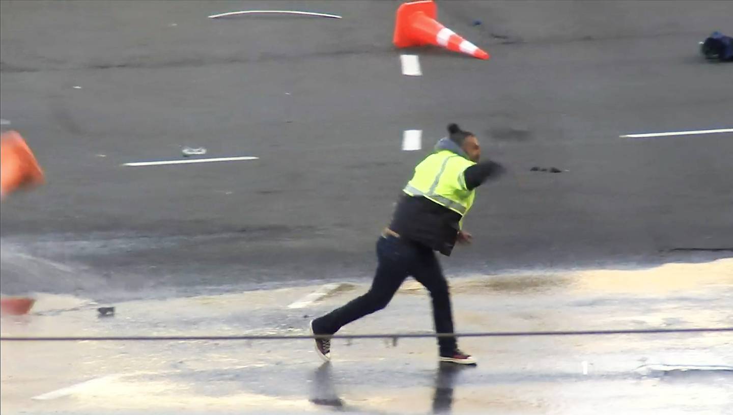 A former Abundant Life School teacher caught on 1News throwing bricks at police during the protest at Parliament on March 2. (Photo / Supplied)