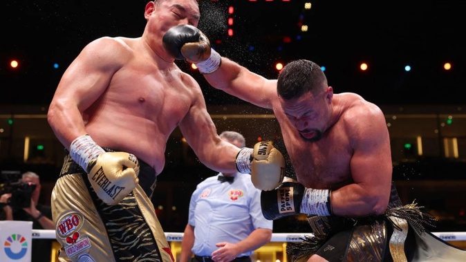 Zhilei Zhang and Joseph Parker exchange punches during the WBO Interim World Heavyweight title fight. Photo / Getty