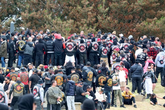 Hundreds of gang members at the tangi of William "Bird" Hines in Foxton in November 2023. Of the gangs pictured, the Head Hunters, Greazy Dogs and Nomads are subject to the current insignia ban under the new Gangs Act, but the Hu-Hu MC (member lower left) are not. Photo / Bevan Conley