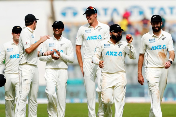 Ajaz Patel of New Zealand and all New Zealand players celebrating his 10th wicket in an innings during day two of the 2nd test match between India and New Zealand. (Photo / Photosport.co.nz)