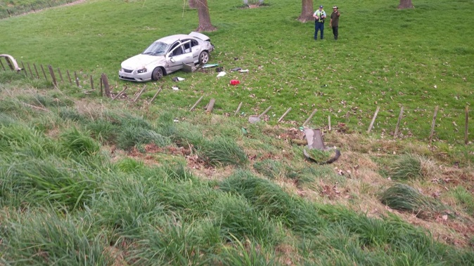 A rolled car has come to rest in a Twyford paddock after a Tuesday-afternoon crash. Photo / Paul Taylor