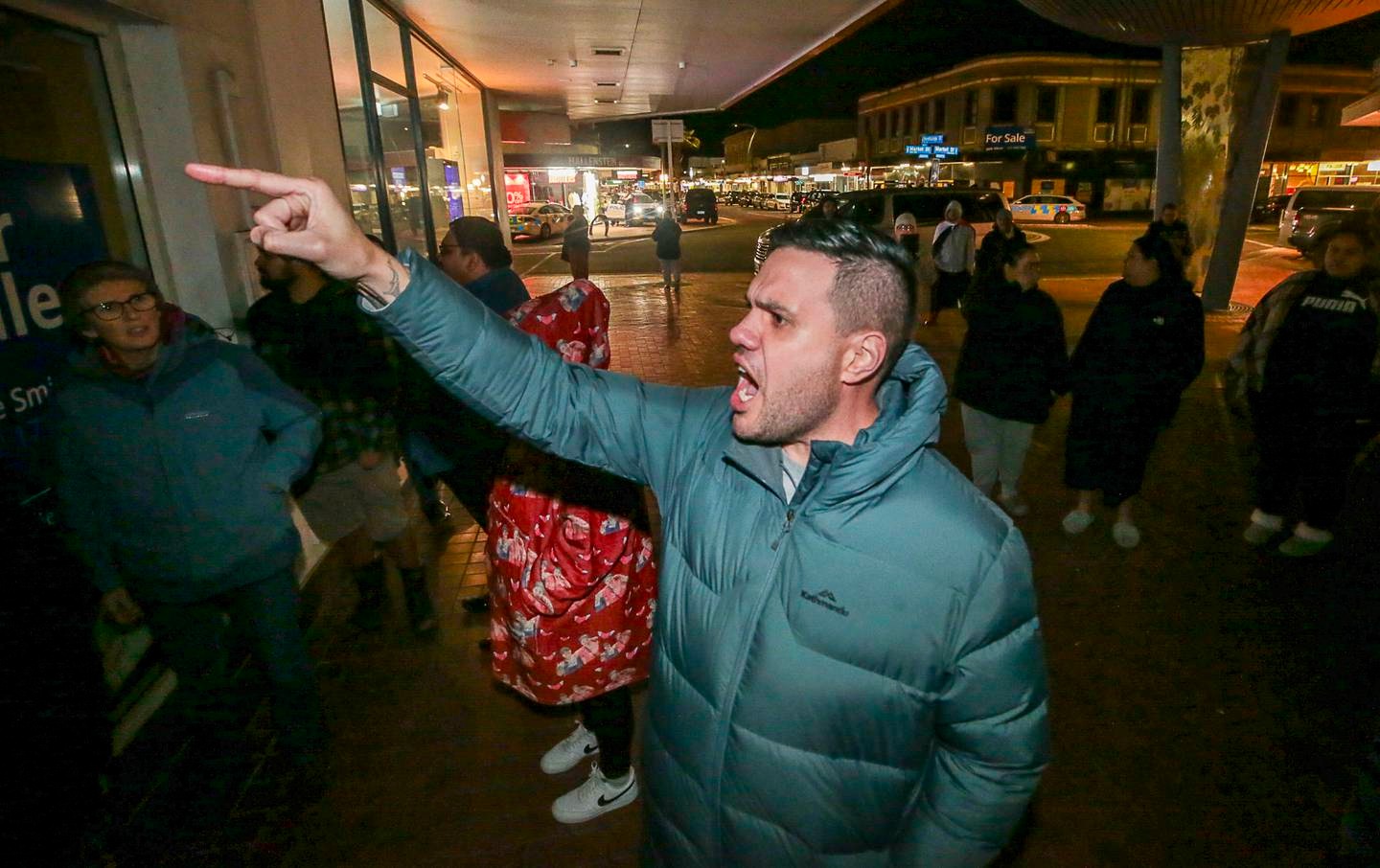 Jeremy Tātere MacLeod protests the Stop Co-Governance meeting in the Hastings CBD on Monday night. Photo / Paul Taylor