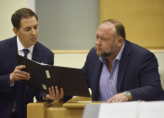 Plaintiff's attorney Chris Mattei, left, questions Conspiracy theorist Alex Jonesduring testimony at the Alex Jones Sandy Hook defamation damages trial at Connecticut Superior Court. Photo / AP