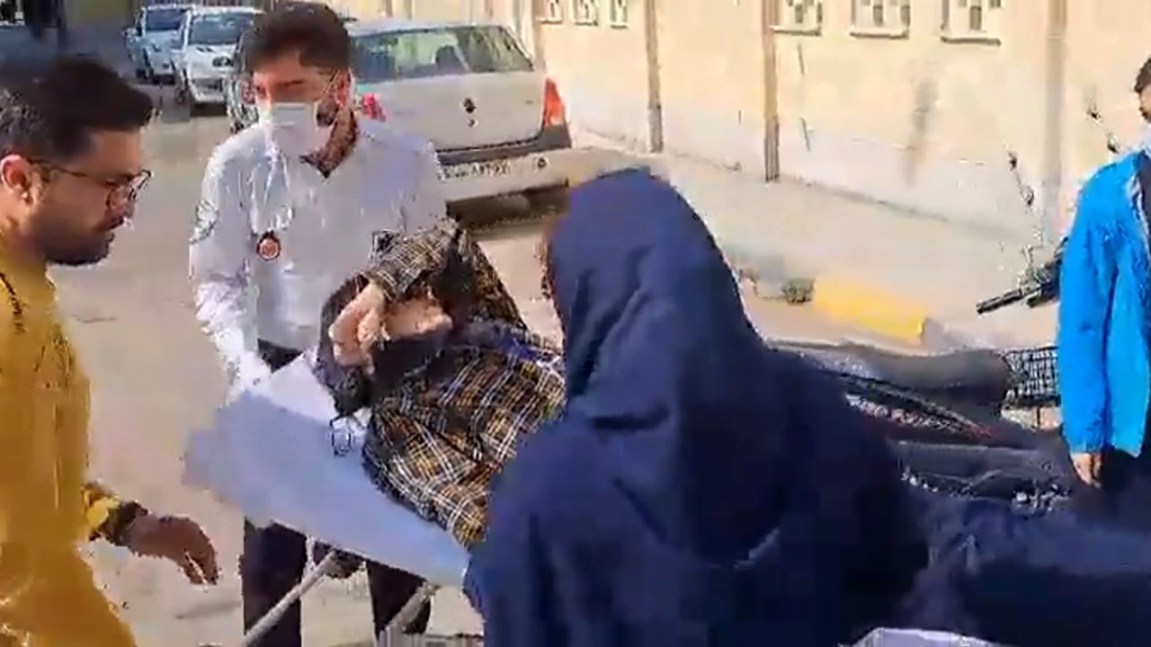 A medical team at the Isfahan University of Technology moves an injured student on a stretcher. 