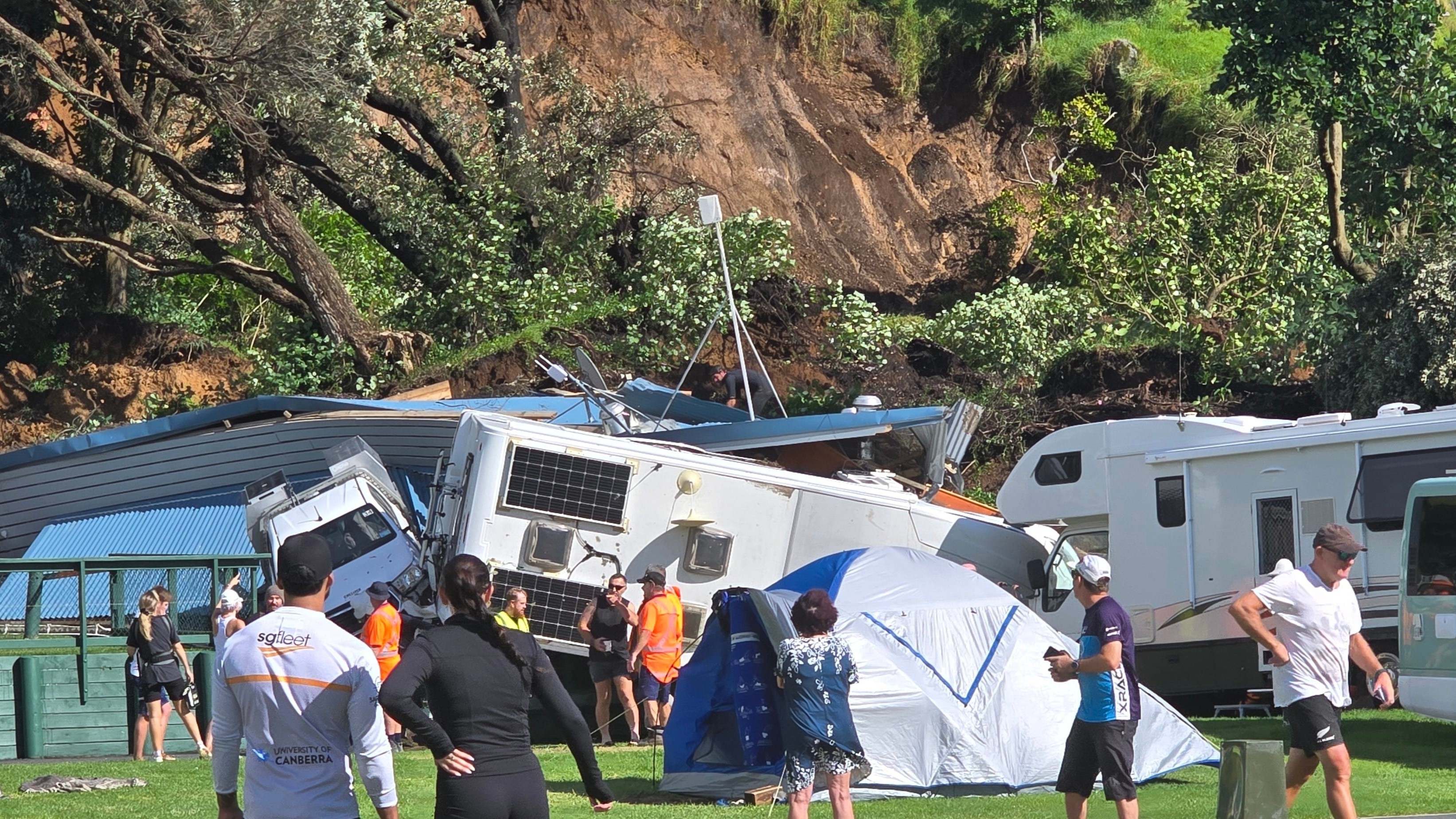 Fears people trapped, screams heard as slip hits tents and campervans at Mount Maunganui
