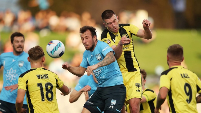 Adam Le Fondre of Sydney FC competes for a header against Tim Payne of the Phoenix. Photo / Getty