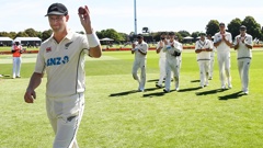 Matt Henry walks off Hagley Oval to applause after his seven-wicket bag. Photo / Photosport
