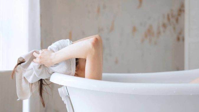 A woman has to pay $20 in reparation after she took a bath after breaking into someone's home. Photo / 123RF