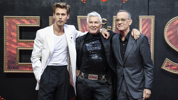 Austin Butler, from left, director Baz Luhrmann, and Tom Hanks pose for photographers upon arrival for the premiere of the film 'Elvis' in London. Photo / AP