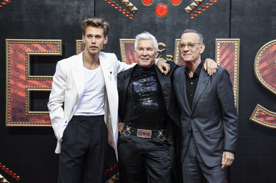 Austin Butler, from left, director Baz Luhrmann, and Tom Hanks pose for photographers upon arrival for the premiere of the film 'Elvis' in London. Photo / AP