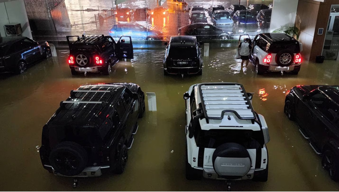 Around 30 luxury vehicles are being assessed for damage after Archibald & Shorter North Shore was flooded on Friday night. Photo / Supplied