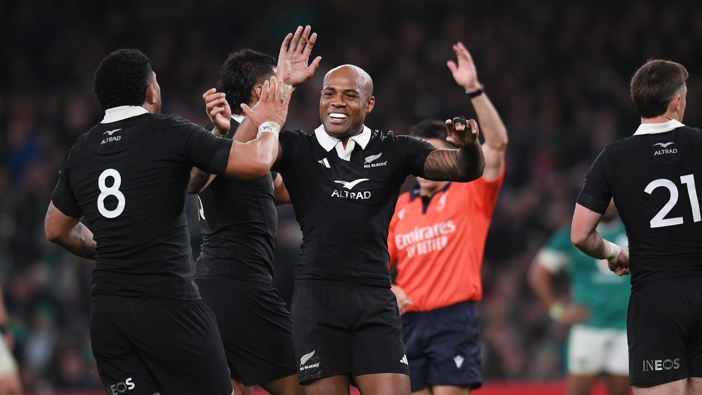 Mark Telea of New Zealand celebrates with team mates following the Autumn Nations Series 2024 match between Ireland and New Zealand All Blacks at Aviva Stadium on November 8, 2024 in Dublin, Ireland. (Photo by Charles McQuillan/Getty Images)