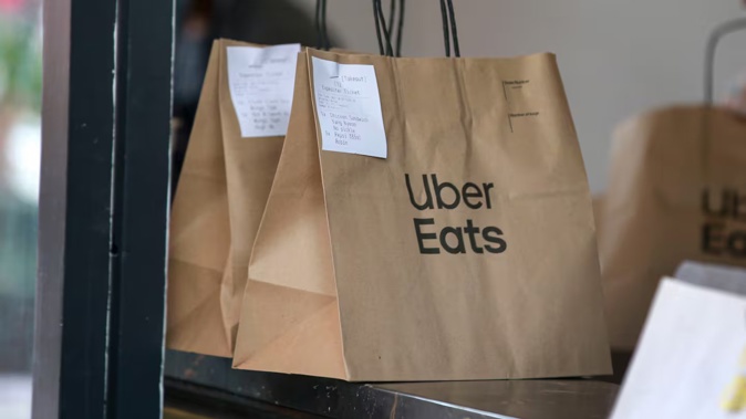 The Uber Eats driver briefly left the car to deliver food. Photo / Alex Burton