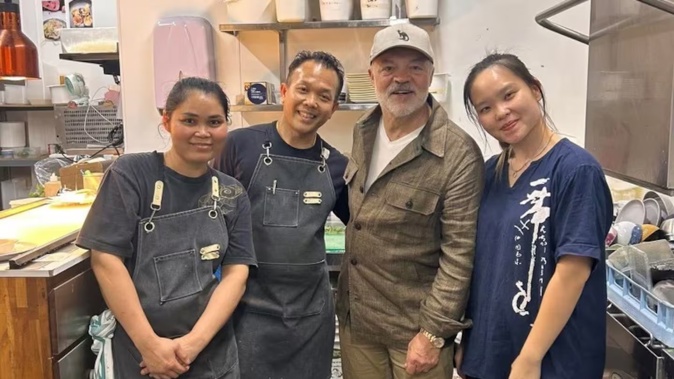 Graham Norton with staff at Christchurch's You Hanoi Me. Photo / Supplied