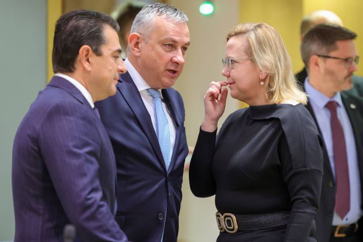 Greek Energy Minister Kostas Skrekas, left, and Czech Energy Minister Jozef Sikela speak with Polish Minister of Climate and Environment Anna Moskwa prior to a meeting of EU energy ministers at an extraordinary energy council in Brussels, on Thursday. Photo / AP