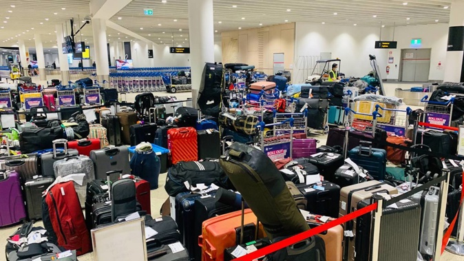 Piles of baggage at Auckland Airport on Christmas Day. Photo / Ant Clausen