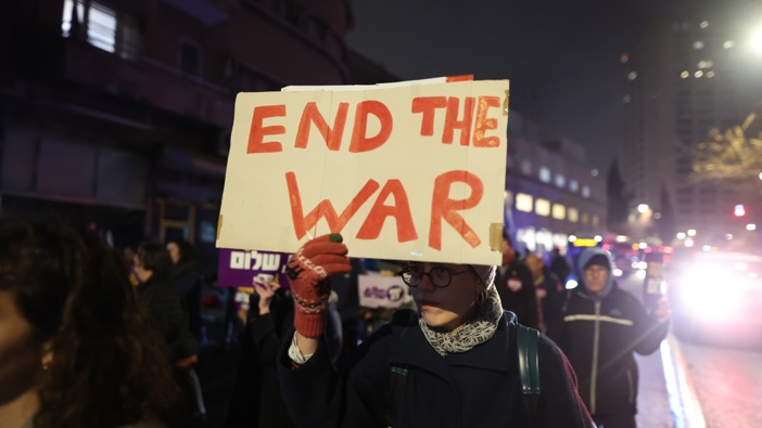 Hundreds of Israelis, holding banners and Israeli flags, gather near the Israeli Prime Minister Benjamin Netanyahu's residence to protest against PM Netanyahu and his government for not signing the ceasefire agreement with Gaza and to demand a hostage swap deal with Palestinians in Jerusalem on January 11, 2025. (Photo by Saeed Qaq/Anadolu via Getty Images)