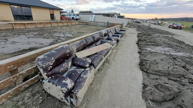 Mud caked high on a property in Eskdale after Cyclone Gabrielle. (Photo / RNZ / Jordan Dunn)