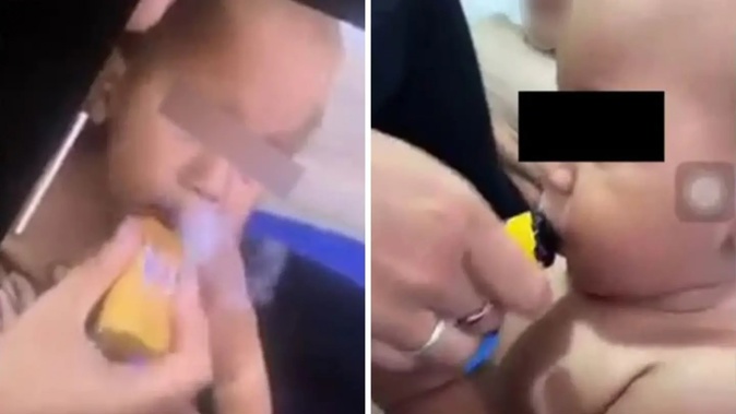 Disturbing footage shows a baby being handed a vape. Photo / Supplied, news.com.au