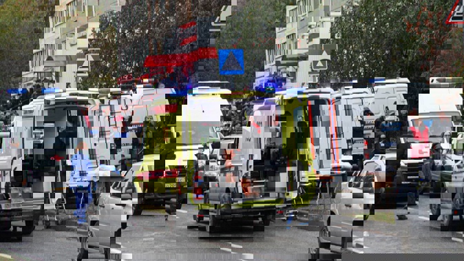 Police and paramedics work at the scene in Izhevsk, Russia. Photo / AP