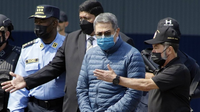 Former Honduran President Juan Orlando Hernández has been convicted in New York of charges that he conspired with drug traffickers, his military and police to enable tonnes of cocaine to make it unhindered into the United States. Photo / AP