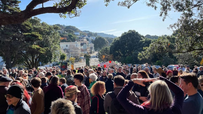 About 300 people have gathered on Victoria University of Wellington's Hunter Lawn against proposed job cuts. Photo / Azaria Howell