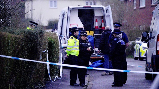 Police work at the scene in Blaise Walk, in Sea Mills, Bristol, England, where a woman has been arrested on suspicion of murder after three children were found dead at a property on February 18, 2024. Photo / AP