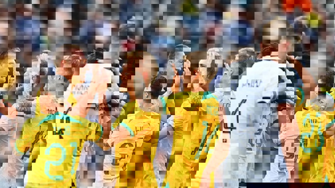 Australian players celebrate their opening goal against the All Whites. Photo / Getty