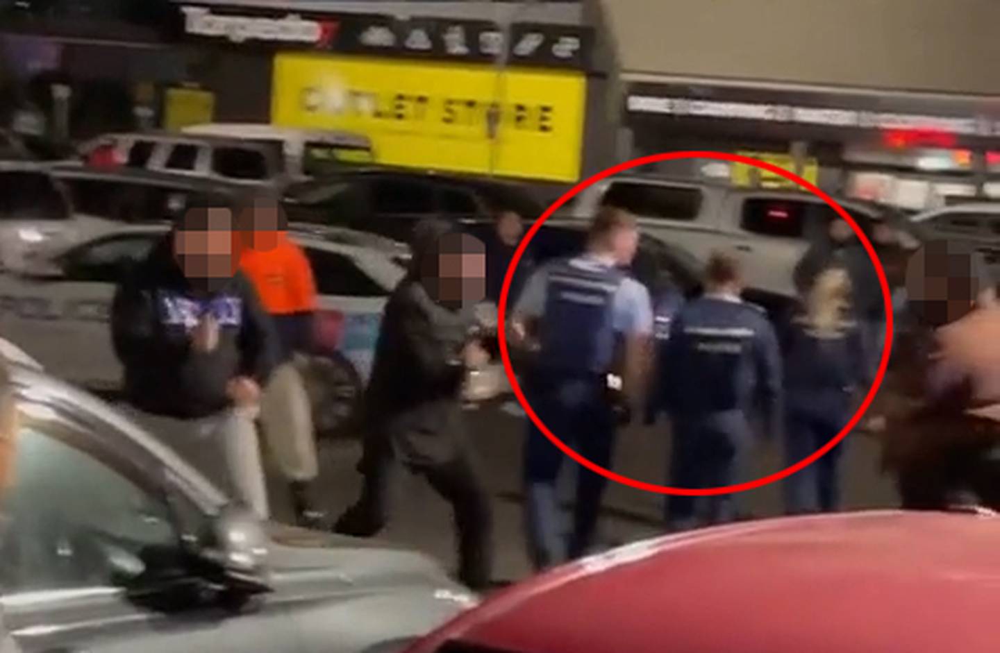 The video showed police moving back as the fight started.