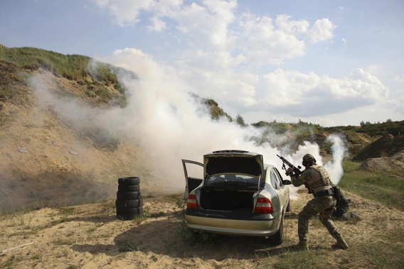 Volunteers from Belarus practice at a shooting range near Warsaw, Poland. Photo / AP