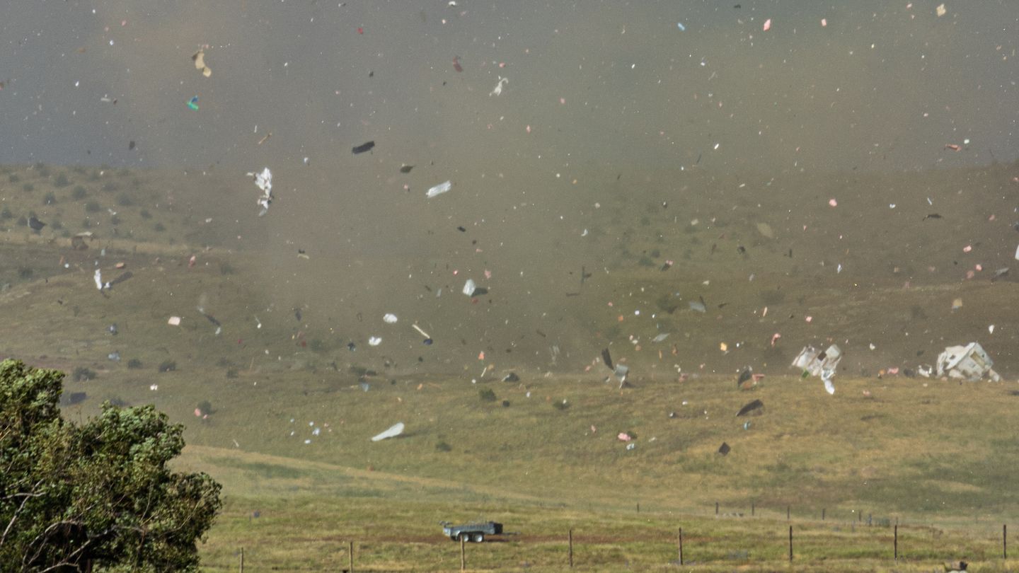 Debris goes flying after a tornado struck properties at Springvale near Alexandra. Photo / Connor Diver