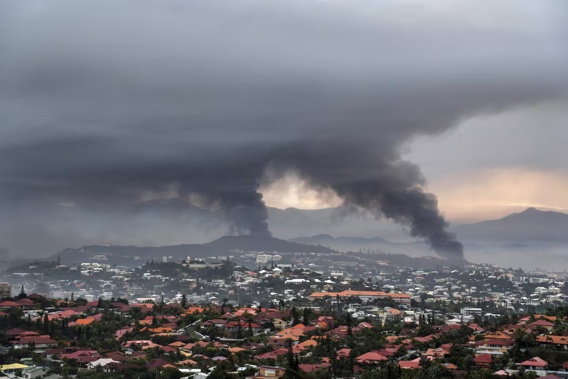 Smoke rises during protests in Noumea, New Caledonia. Photo / AP
