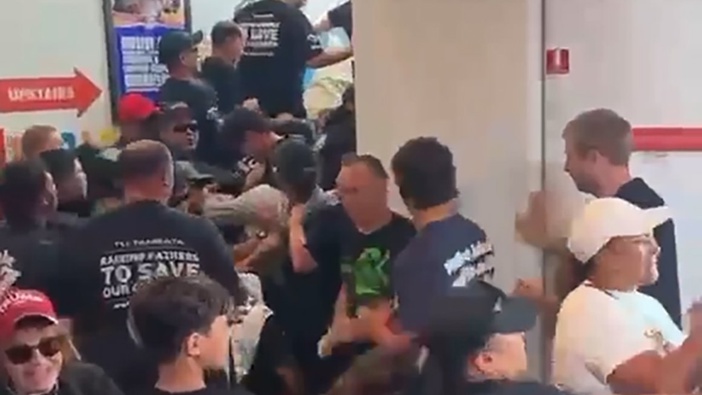 Destiny Church members attack people as they stage a protest in the Te Atatu Community Centre against a children's library drag event. Photo / Supplied, still from video