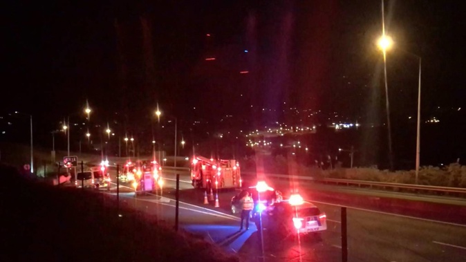 Emergency services personnel attend the scene of a serious accident near the Lookout Point Fire Station on Monday night. (Photo / Oscar Francis)