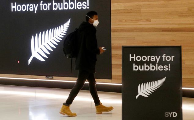 A passenger prepares to fly from Sydney Airport to New Zealand. (Photo / AP)