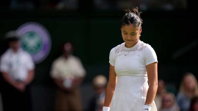Britain's Emma Raducanu prepares to serve to France's Caroline Garcia during their singles tennis match against on day three of the Wimbledon tennis championships. Photo / AP