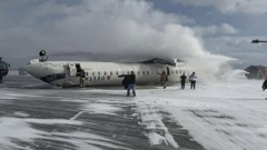 A Delta Air Lines plane was filmed upside down after allegedly crash landing. Photo / John Nelson, Facebook