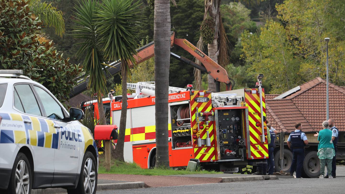 Emergency services at the scene of the crash on a residential property in Kerikeri. Photo / Peter de Graaf