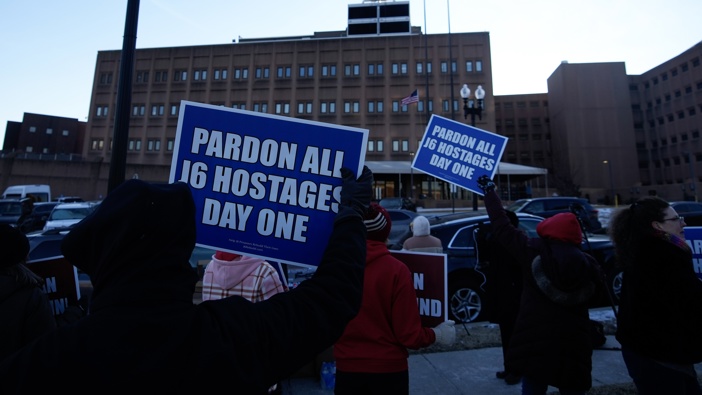 People gather at the DC Central Detention Facility on on January 20, 2025 in Washington, DC. Donald Trump has alluded to pardoning January 6 rioters after taking office for his second term as the 47th president of the United States. (Photo by Bryan Woolston/Getty Images)