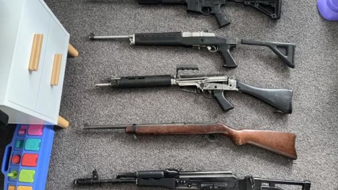 Police found five military-style semi-automatics in children's bedrooms while executing a search warrant at a Napier home. Photo / NZ Police via RNZ