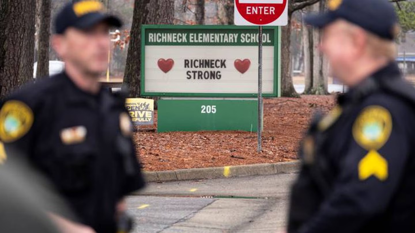 Police look on as students return to Richneck Elementary in Newport News, Virginia, at the end of January after a 6-year-old boy shot his teacher. Photo / via AP