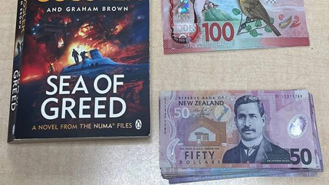Hidden cash was intercepted just in time, with the pensioner reunited with his money. Photo / New Zealand Police